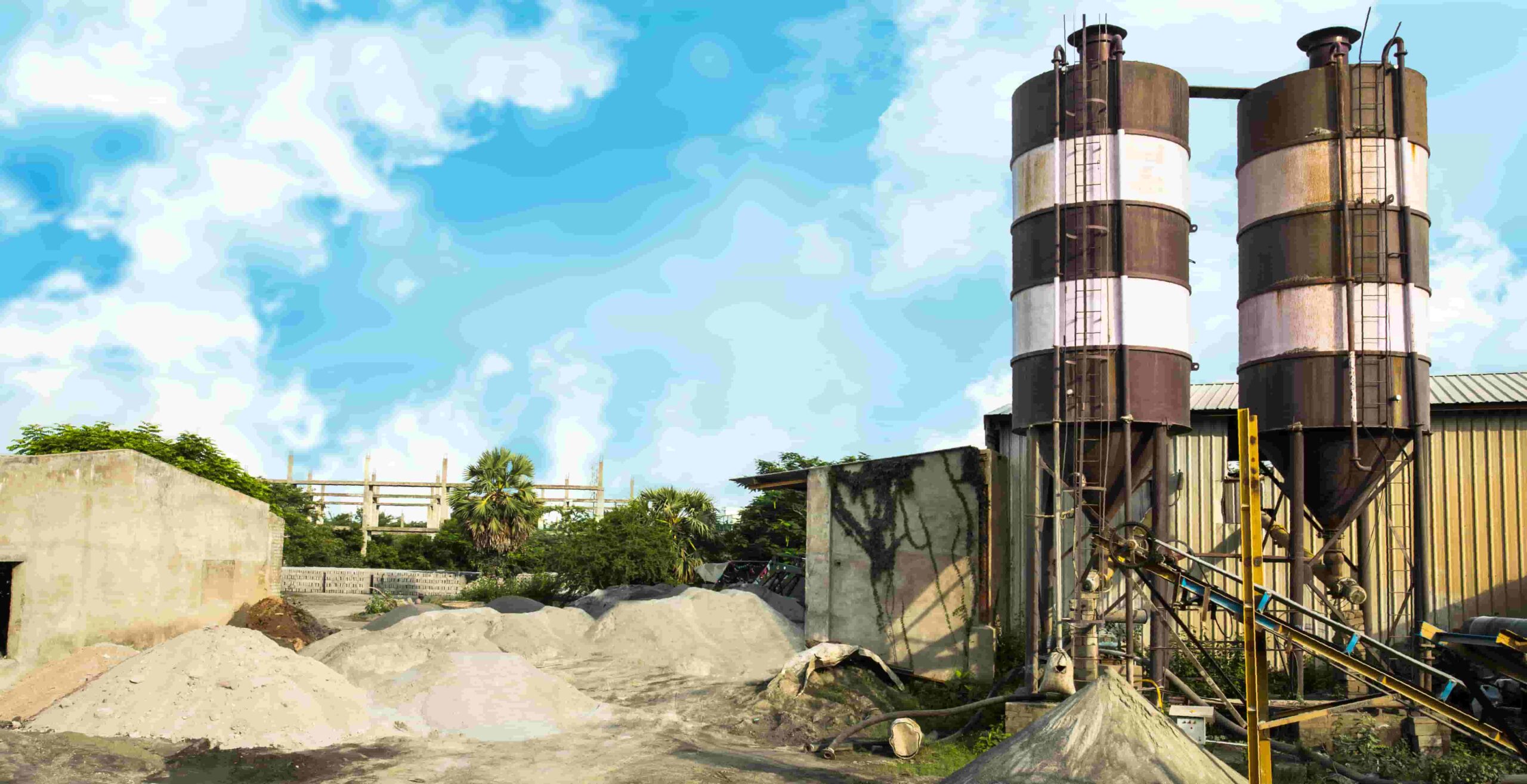Fly ash equipment near some piles of stone.